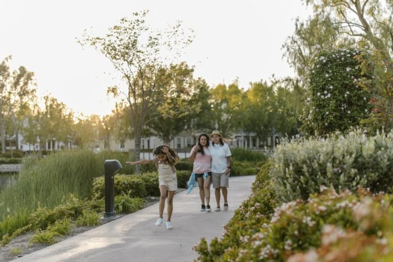 A family walking together along a quiet park path