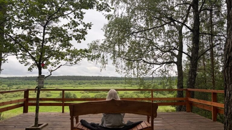 A person sitting quietly alone in a dim, calm room