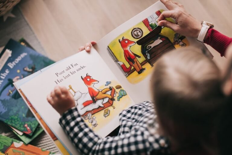 A child sitting cross-legged on a rug, reading a picture book